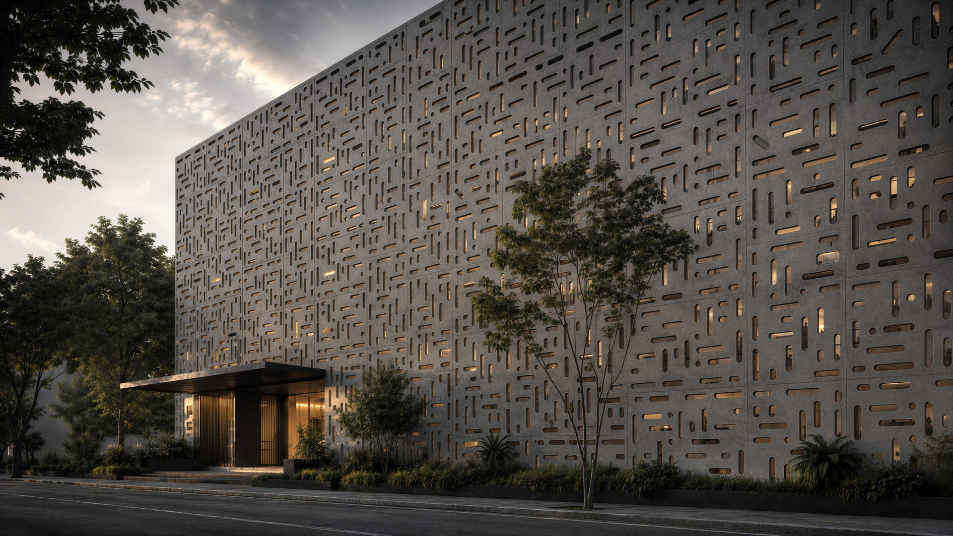 Edificio de oficinas con fachada paramétrica de hormigón al atardecer