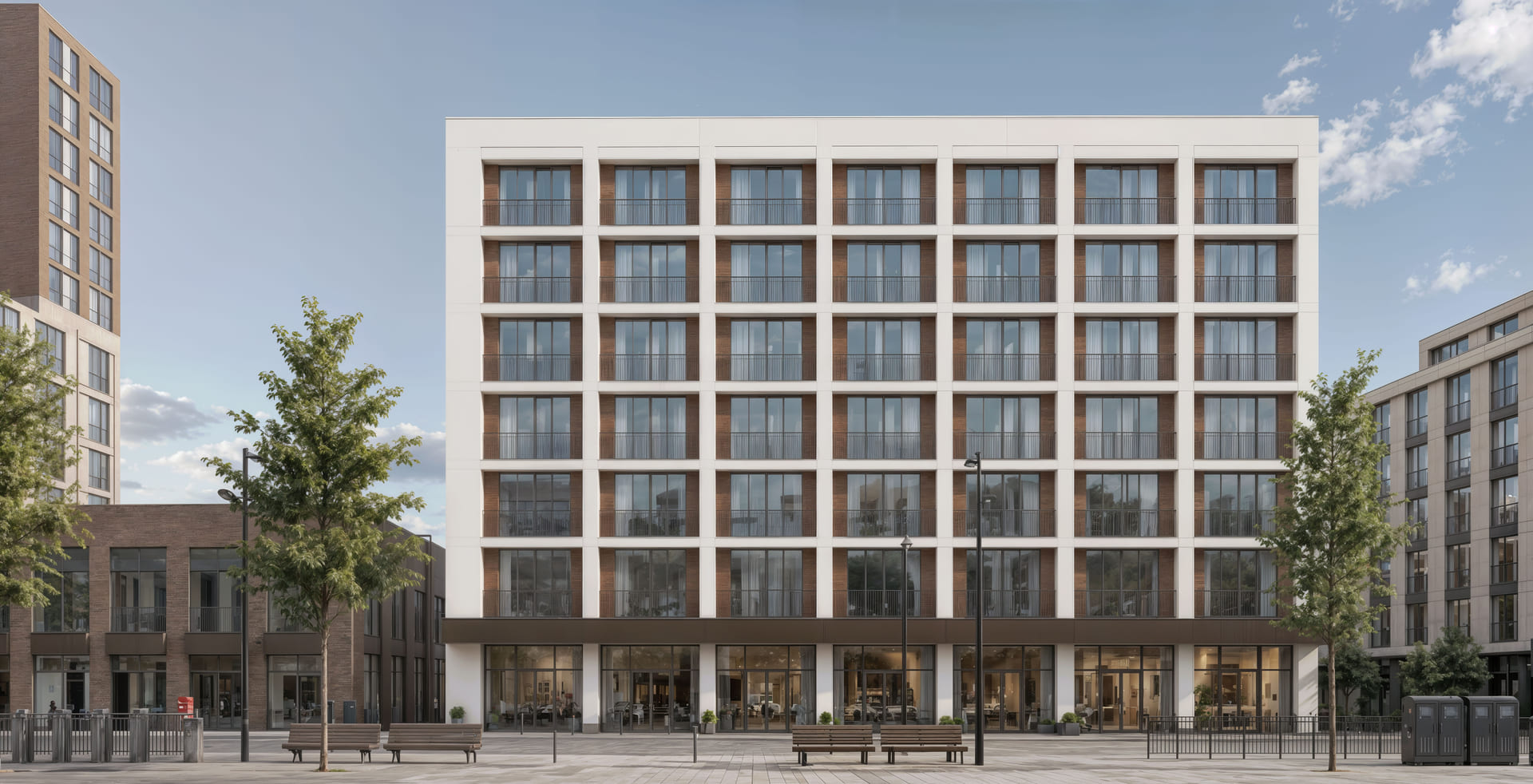 Residential block front facade with balconies and ground-floor amenities